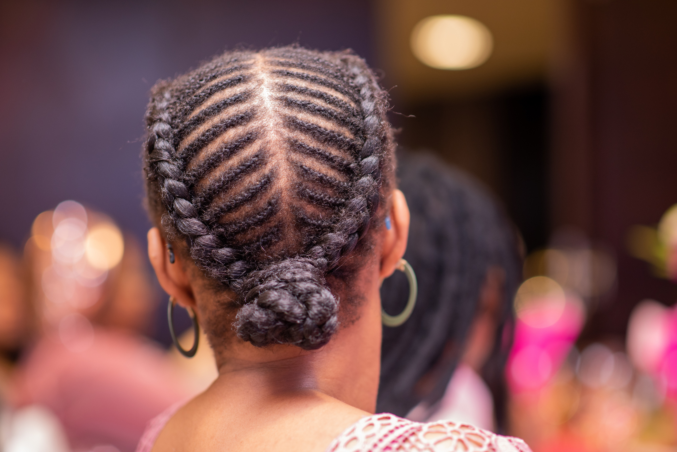 Woman with braids shot from directly behind